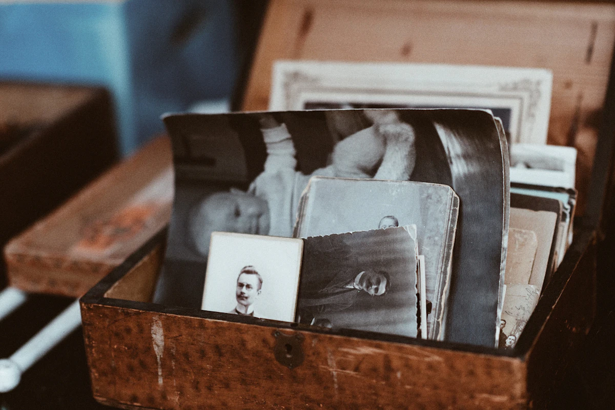 Old photographs gathered in a wooden chest